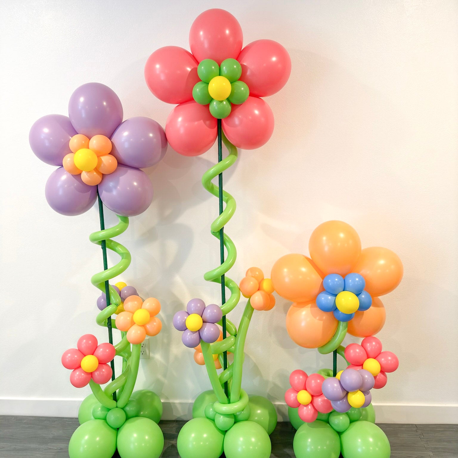 Colorful balloon flower stands on a plain background