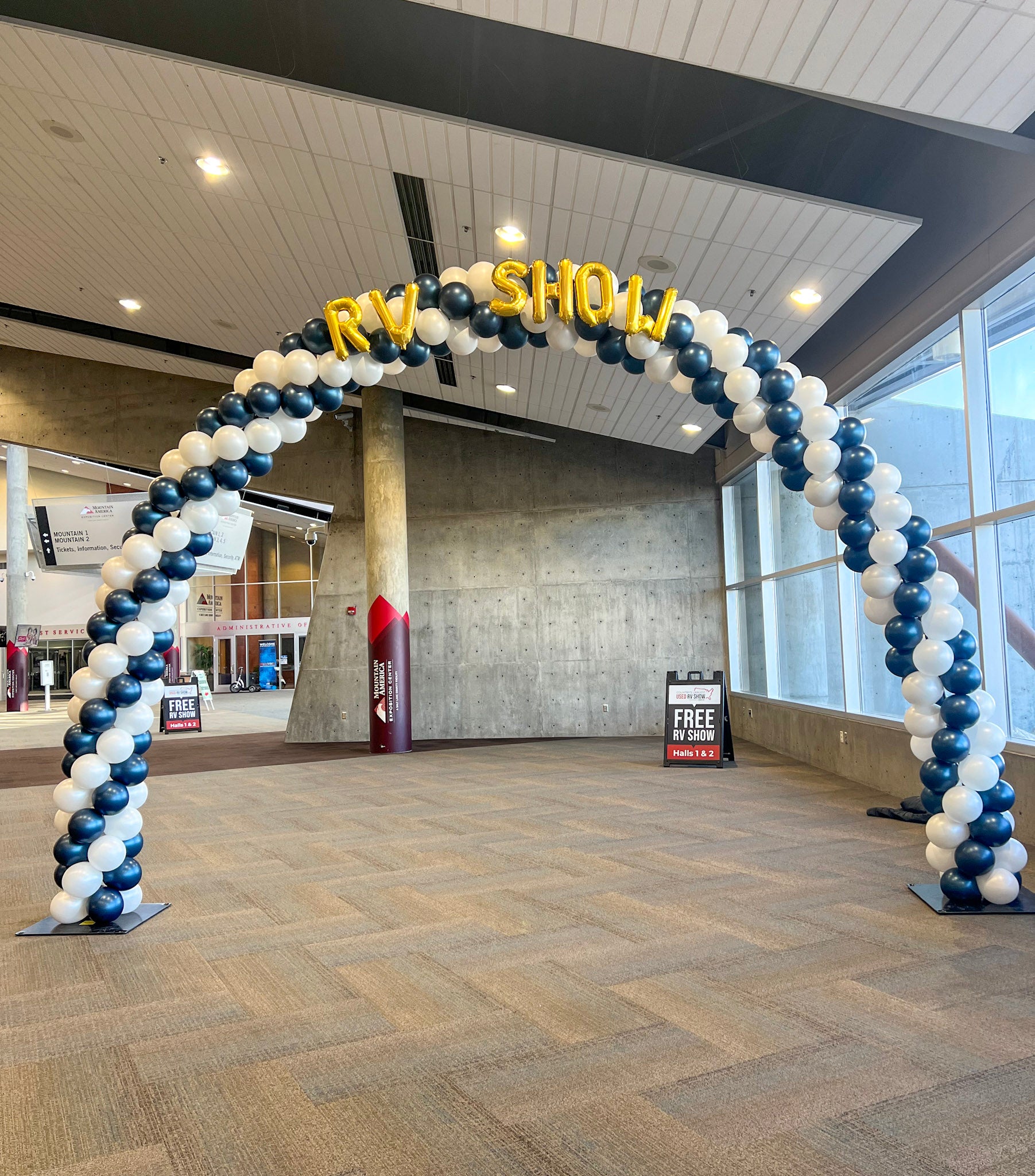 Balloon arch with 'RV Show' balloon letters at the mountain america expo center for the RV Show