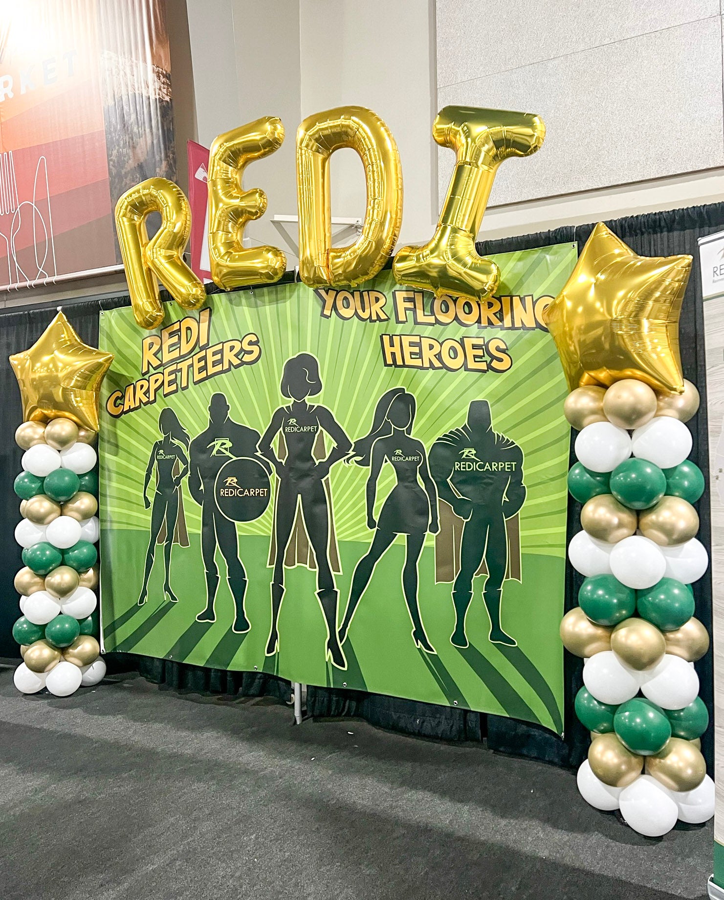 REDI flooring balloon columns with jumbo balloon letters frame backdrop in a lovely helium arch at the mountain america expo center