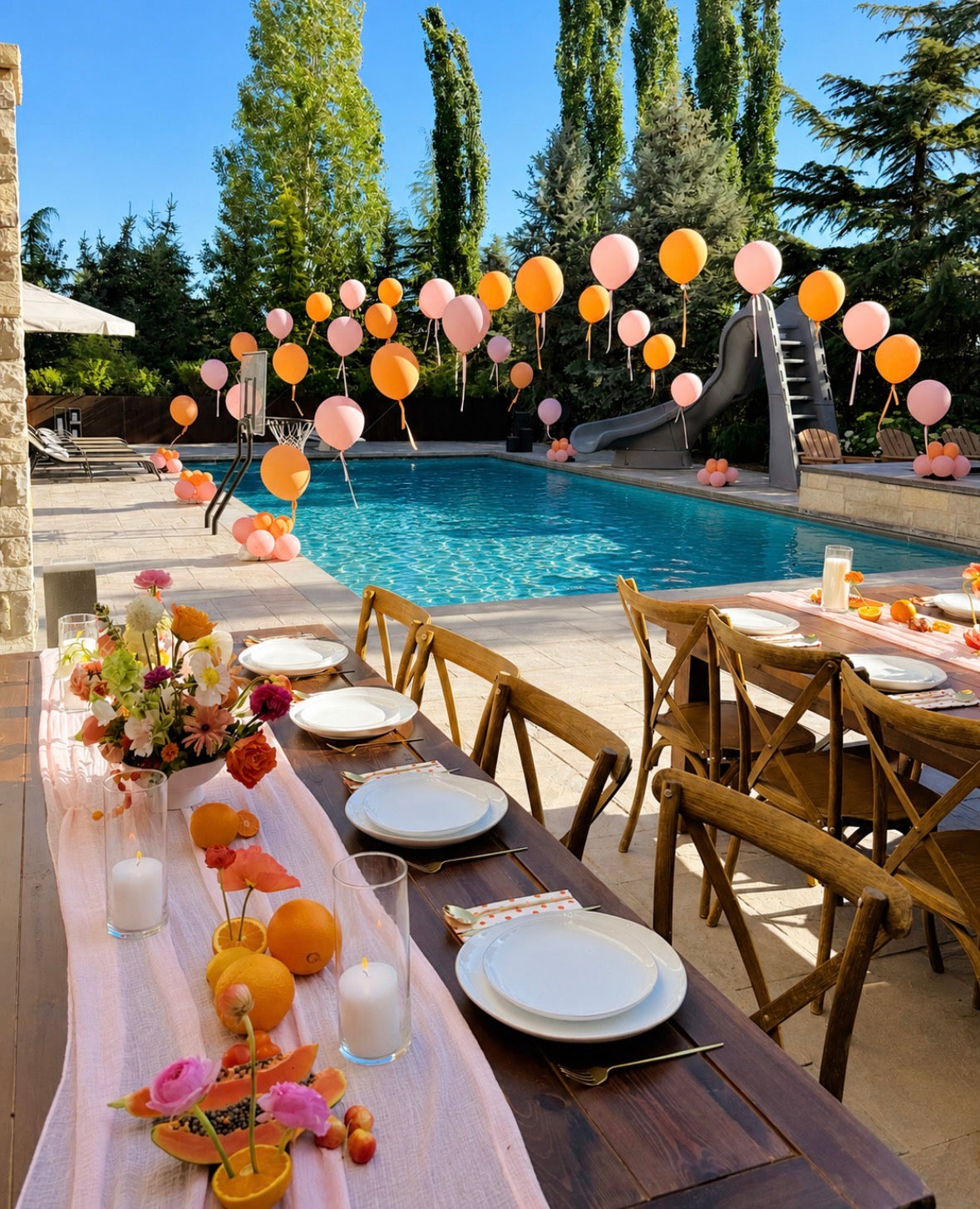 pink and orange balloons arch across a pool in 3 spots