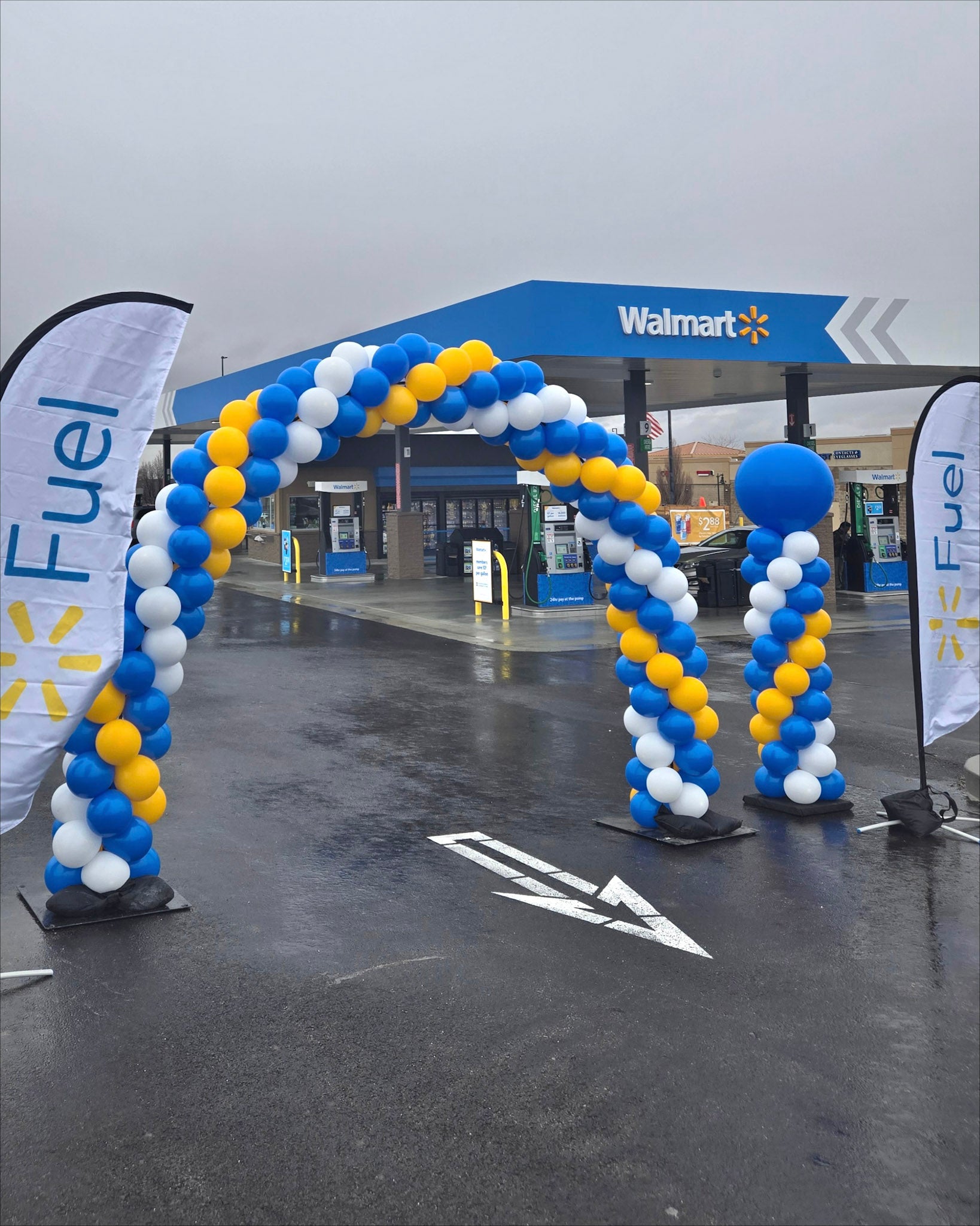 Blue, yellow, white classic balloon arch and column 